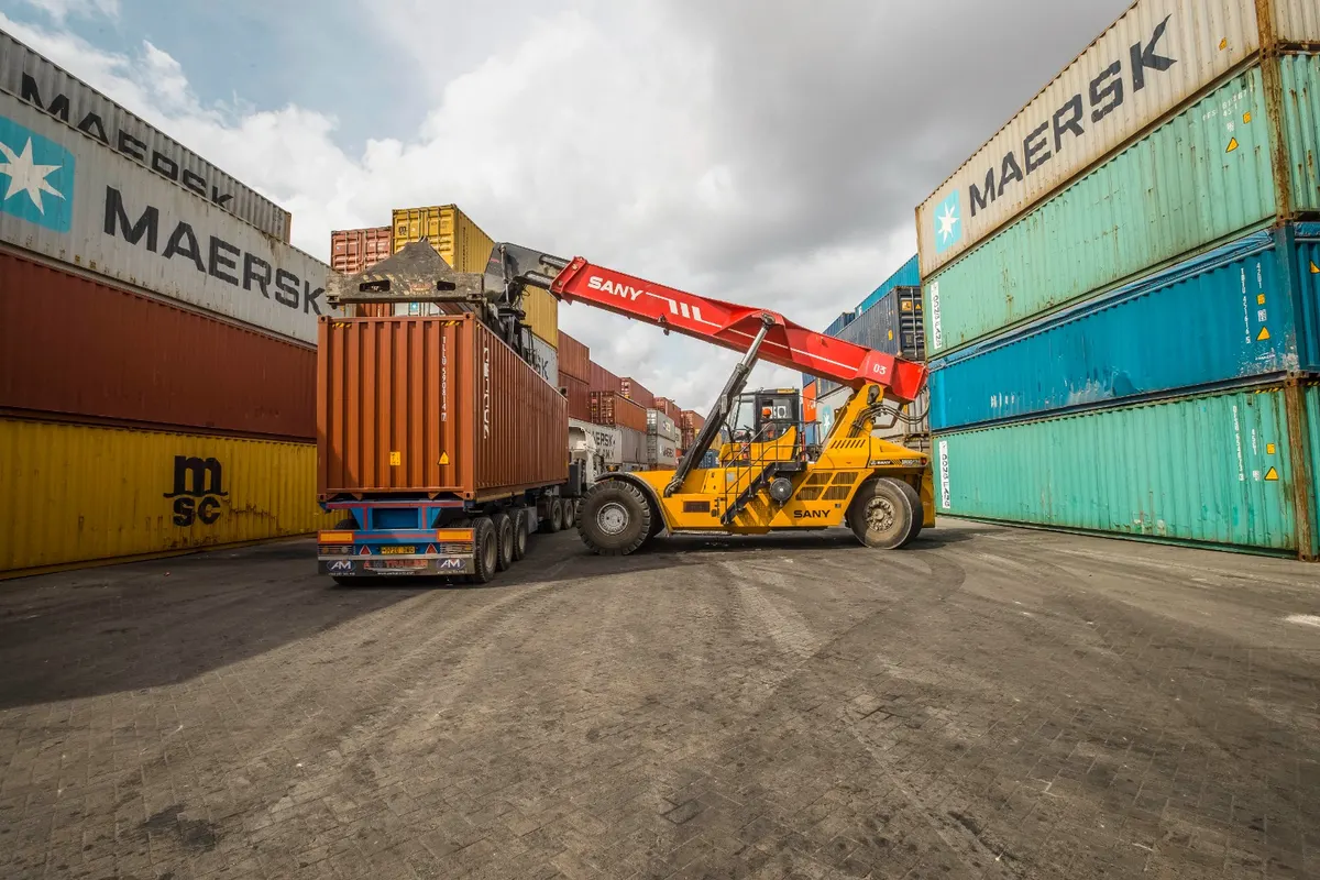 AFICD reach stacker loading a container onto a truck