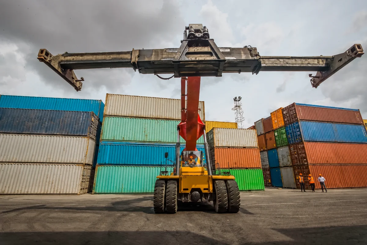 AFICD reach stacker handling shipping containers