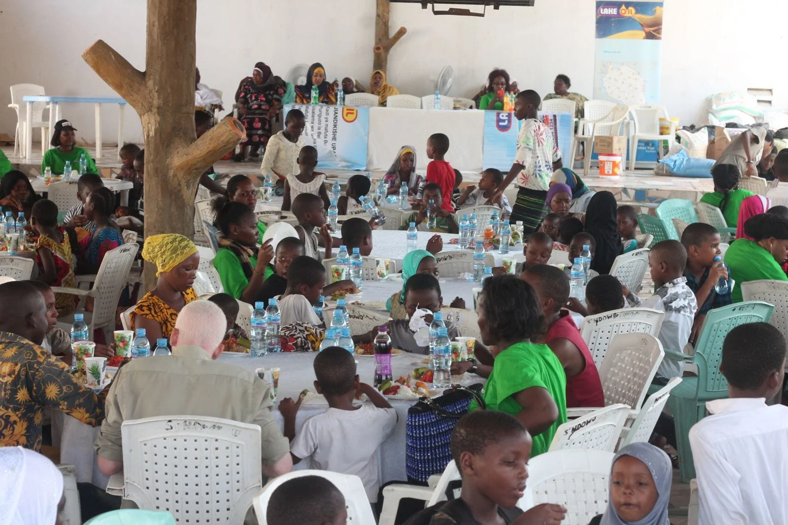 Children and Lake Group representatives at a Kigamboni community gathering